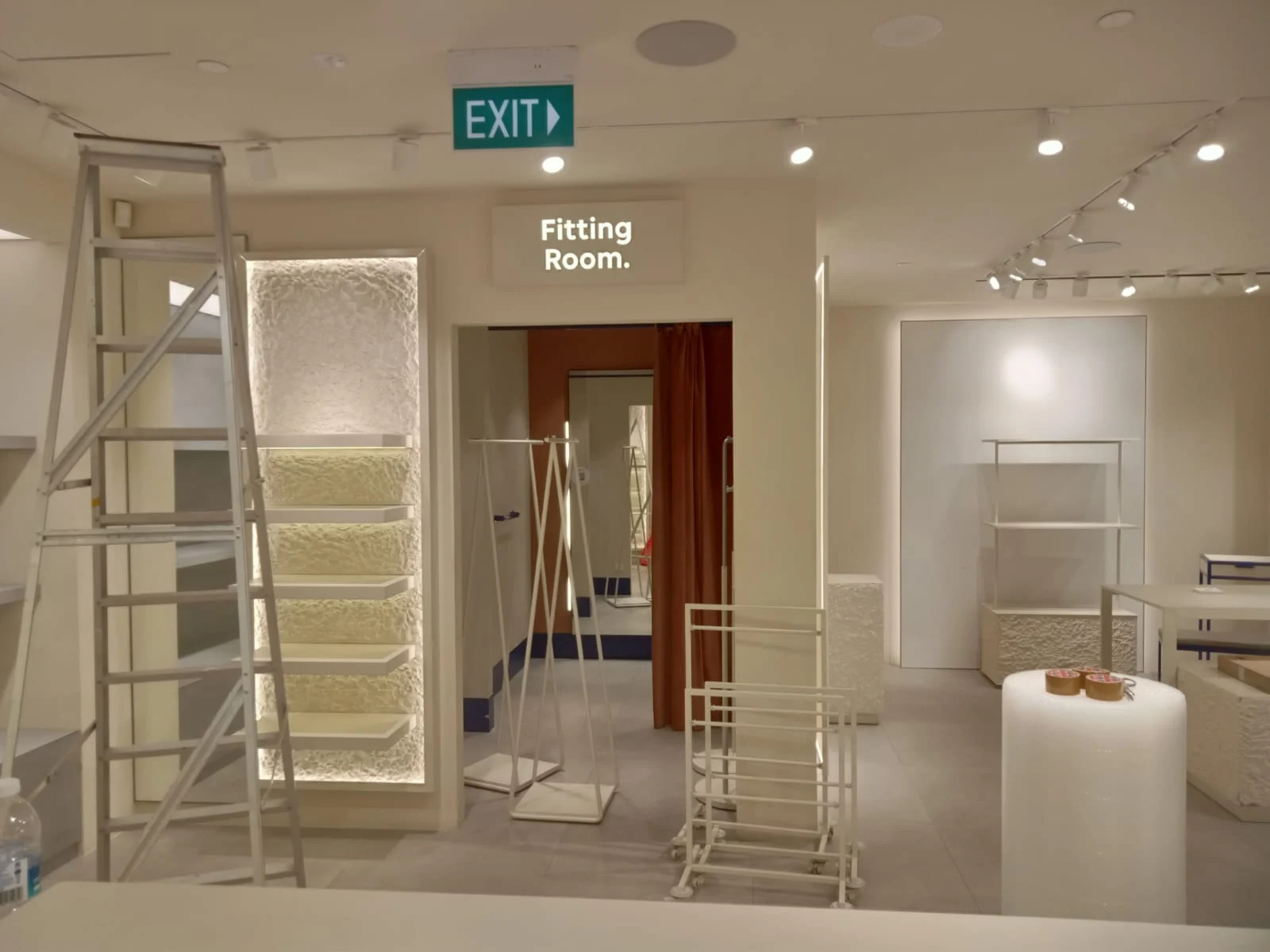 Retail shop renovation in progress with fitting room